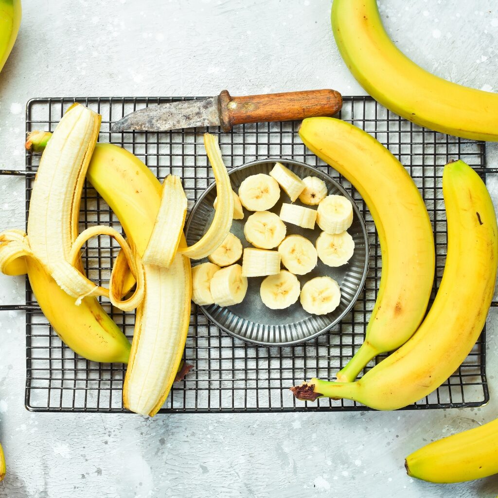 Fresh and Sliced Bananas on a wire rack and plate
