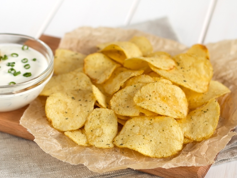 Potato Chips on a Parchment Paper with Mayo Dip