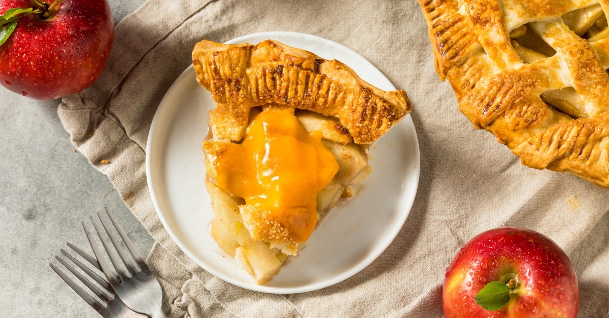 Sliced Homemade Sweet American Apple Pie with Cheddar Cheese