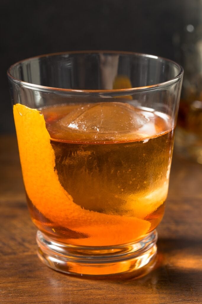 Vieux Carre Cocktail with Ice and Lemon Wedge