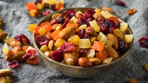 Bowl of Healthy Dried Fruits and Nut Mix with Almonds, Raisins and Cranberries