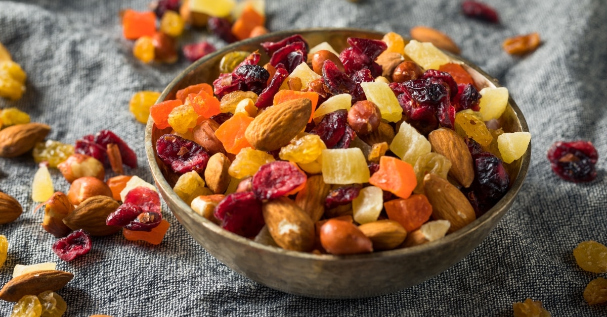 Bowl of Healthy Dried Fruits and Nut Mix with Almonds, Raisins and Cranberries