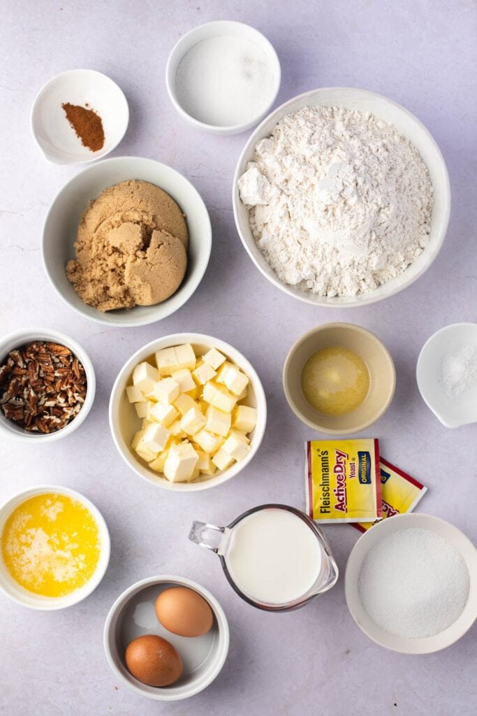 Caramel Pecan Cinnamon Roll Ingredients - Dry Yeast, Milk, Eggs, Butter, Sugar, Flour, Corn Syrup, Pecans and Cinnamon