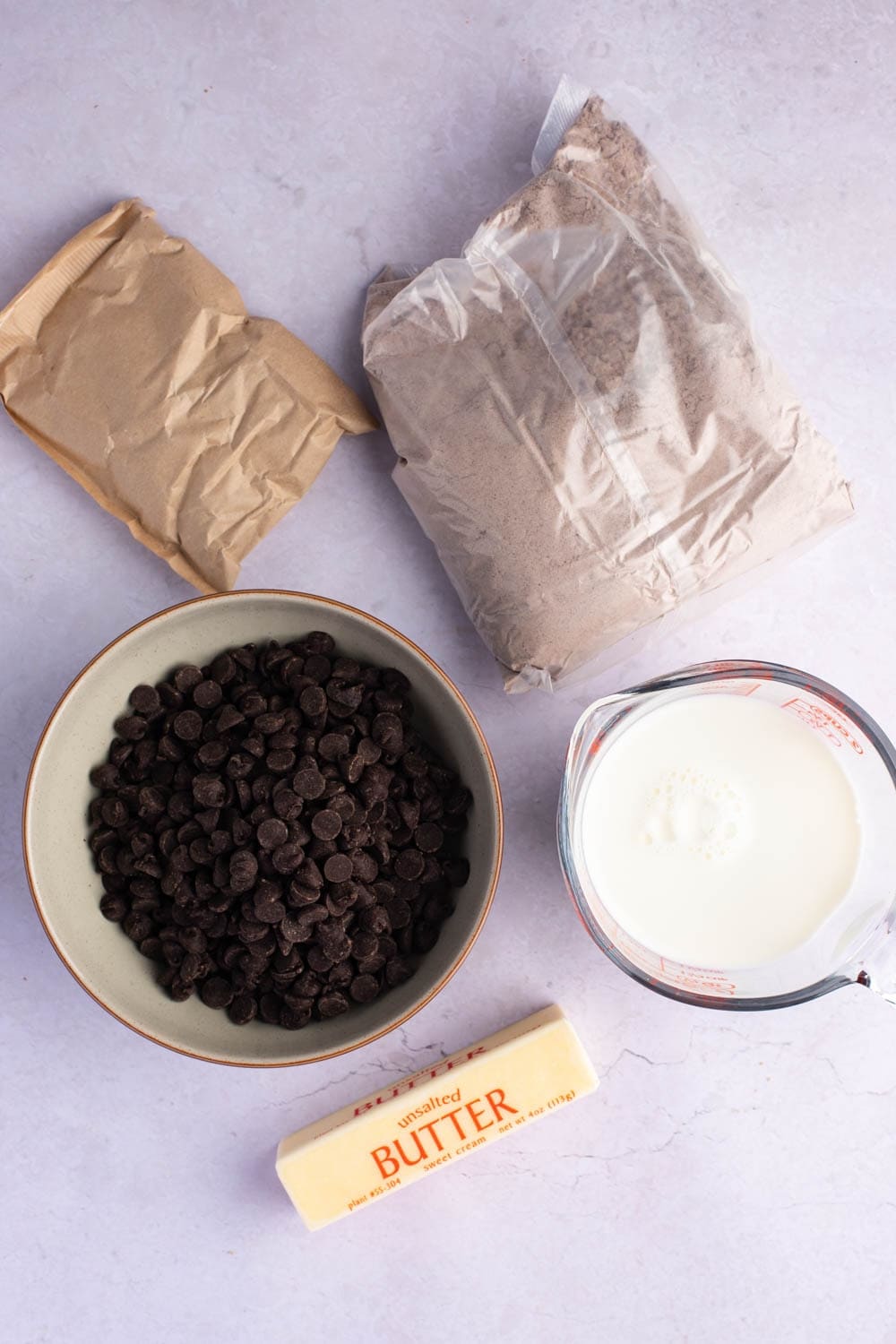 Chocolate Dump Cake Ingredients - Chocolate Cake Mix, Dry Pudding Mix, Whole Milk, Butter, and Chocolate Chips