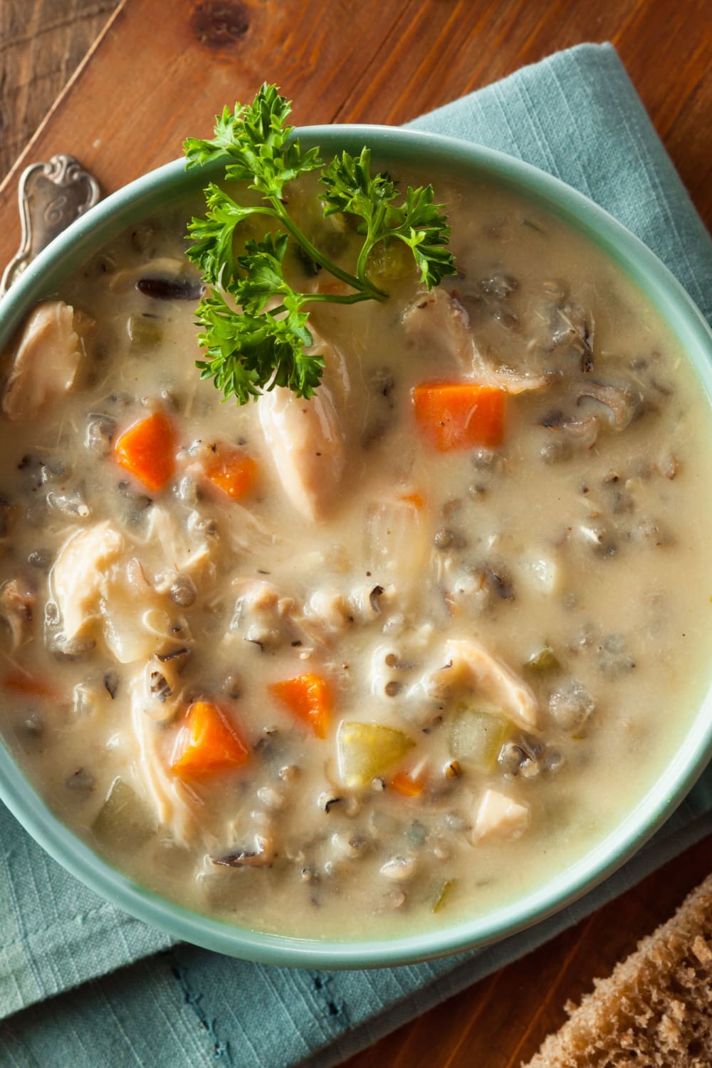 Creamy Chicken Rice Soup in a Bowl with Carrots and Celery 