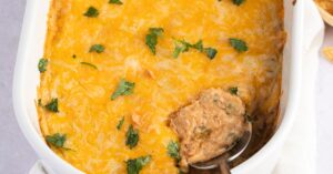 Delicious Homemade Texas Trash Dip with Refried Beans, Green Chiles and Cheese