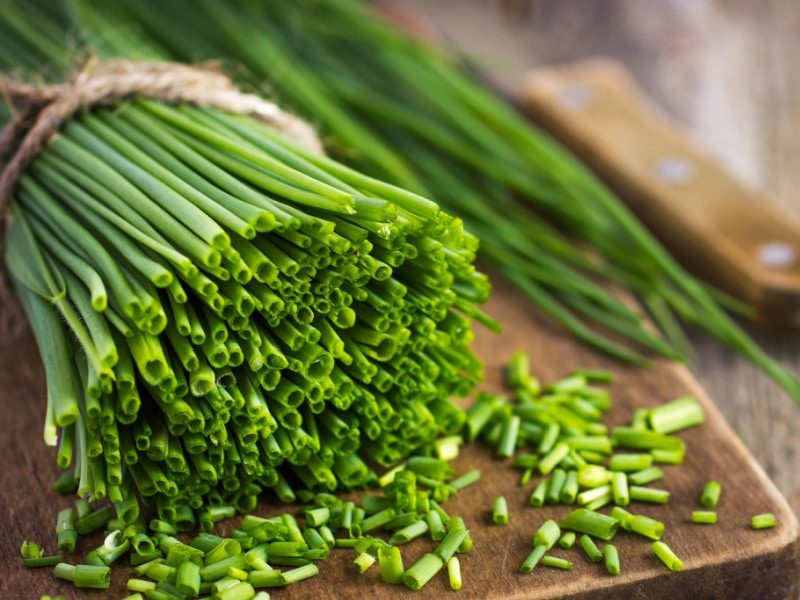 Fresh Chives on a Wooden Cutting Board 