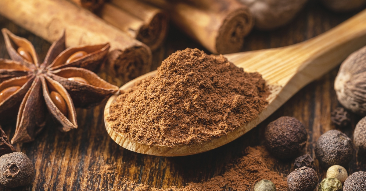Ground Cinnamon in a Wooden Spoon