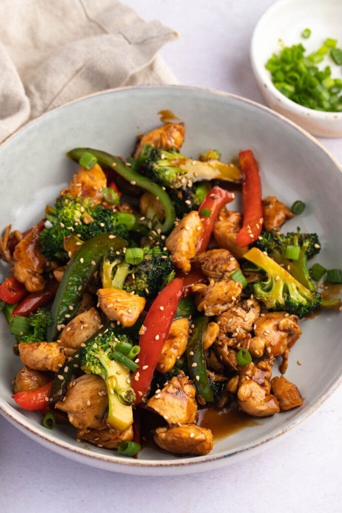 Healthy Homemade Stir-Fry Chicken and Vegetables with Sesame Seeds and Sauce