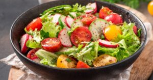 Healthy Homemade Vegetable Salad with Raddish, Lettuce, Tomatoes and Cucumber