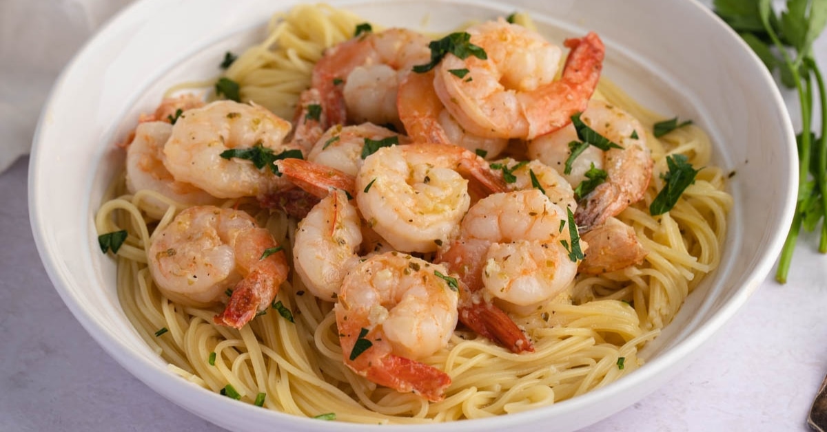 Homemade Shrimp Scampi with Pasta and Herbs in a White Bowl