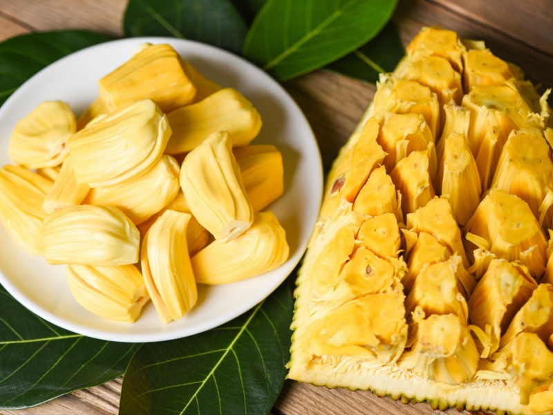 Ripe jackfruit in the skin and on a plate