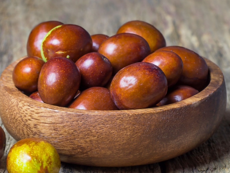 Fresh Ripe Jujube Fruits in a Wooden Bowl