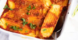 Manicotti Pasta with Tomato Sauce and Herbs in a White Casserole