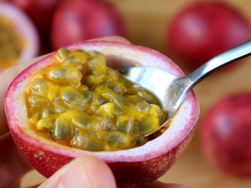 Ripe Passion Fruit Scooped With Spoon