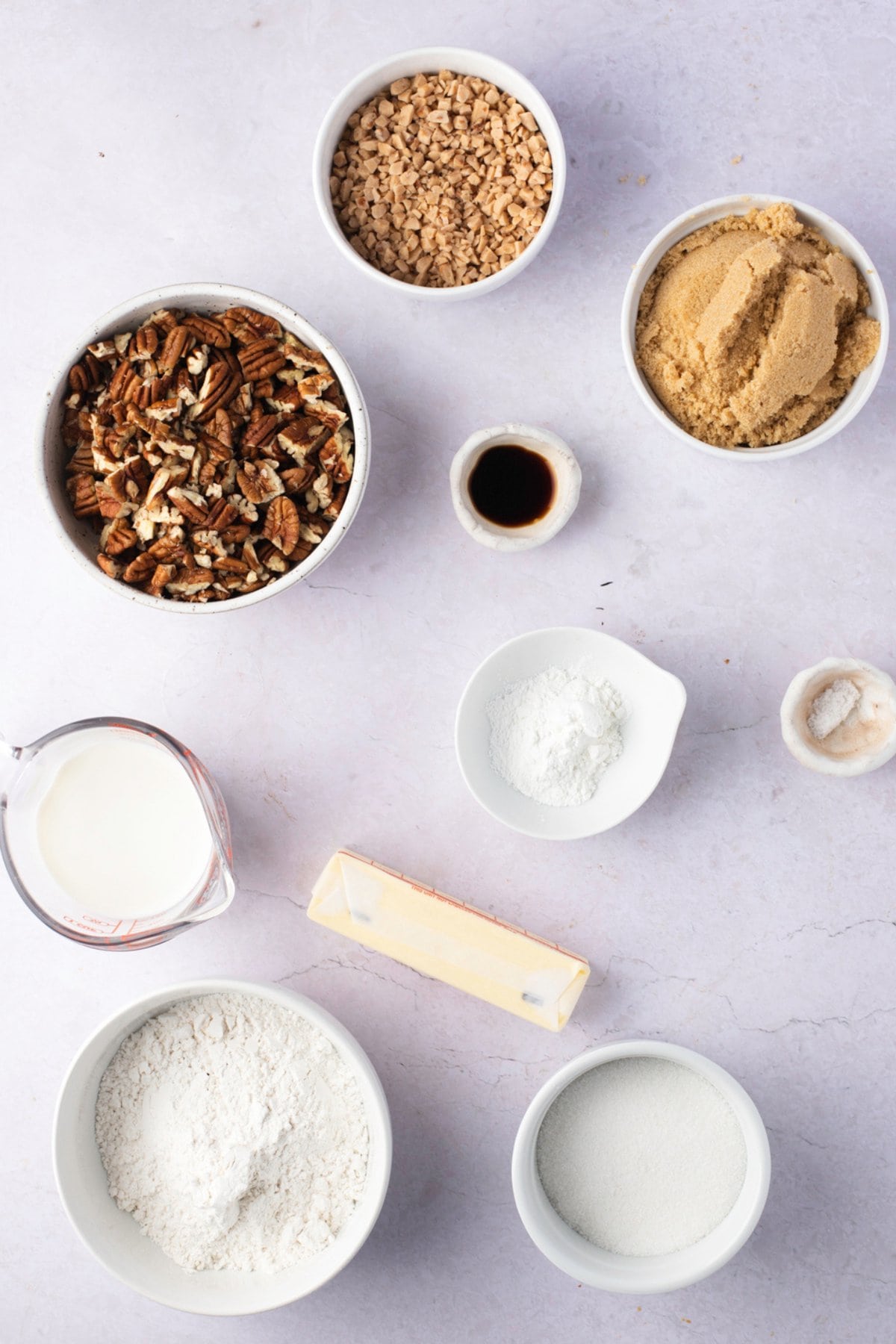 Pecan Pie Cobbler Ingredients - Butter, Flour, Sugar, Baking Powder, Milk, Pecans, Brown Sugar, Toffee Bits, Boiling Water