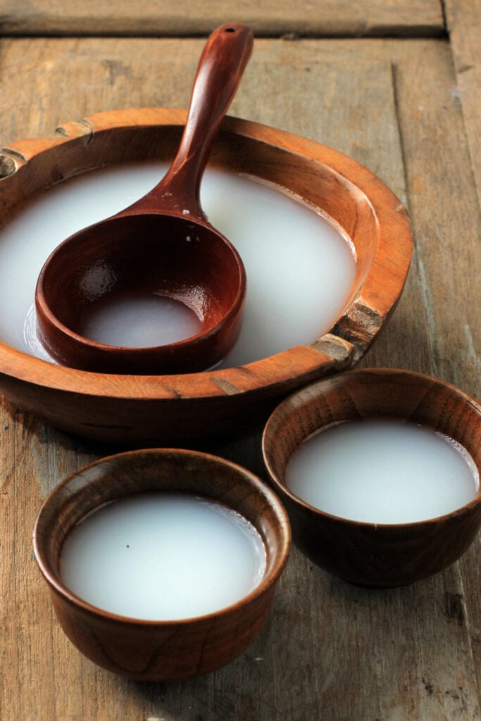 Traditional Rice Wine on Wooden Bowls
