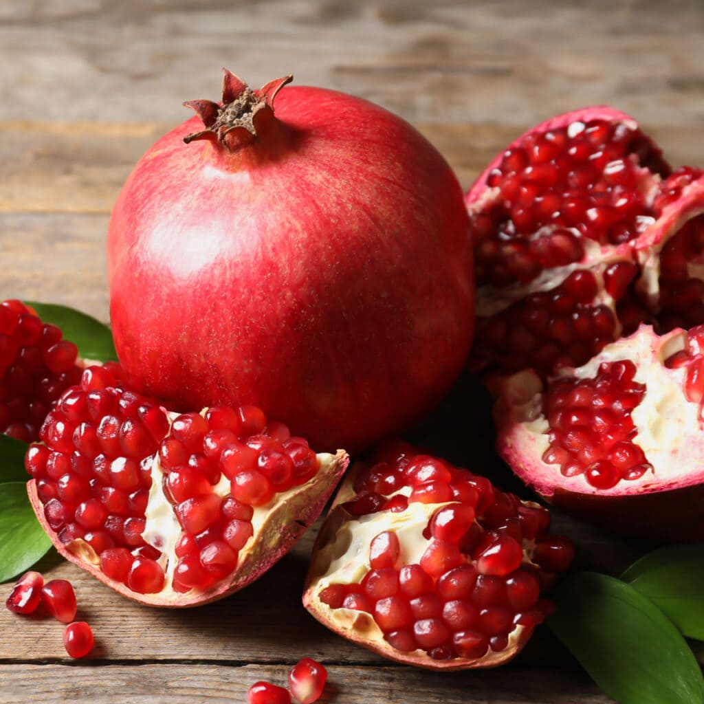 Ripe Whole and Cut Open Pomegranates - How to Tell If a Pomegranate Is Ripe