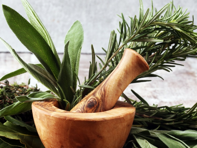 Sage and Thyme on a Mortar and Pestle