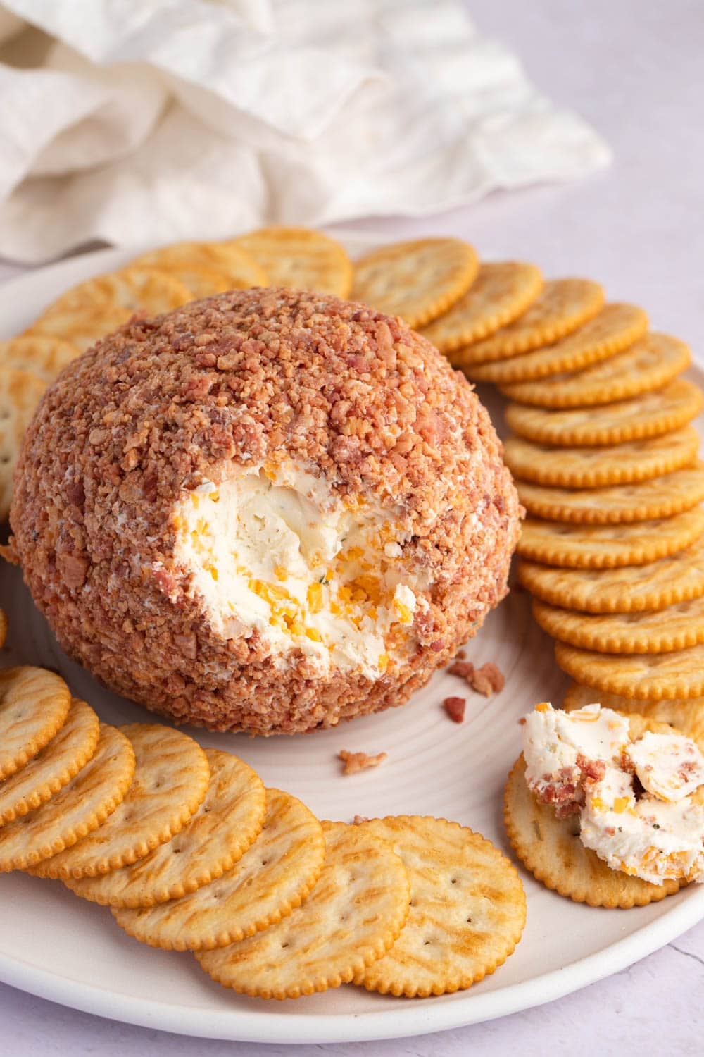 Bacon Ranch Cheese Ball served with crackers. 
