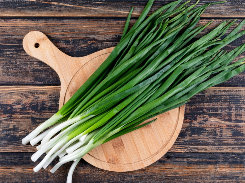 Scallions on a Wooden Cutting Board
