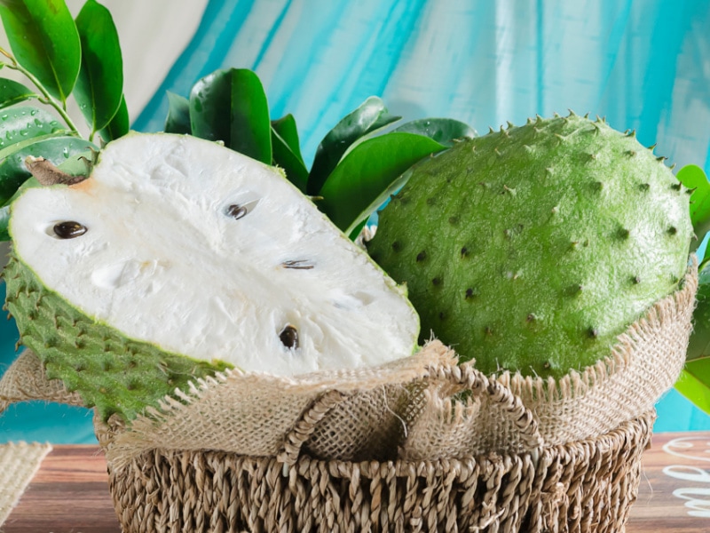 Soursop (Guyabano) with Leaves in a Rustic Cloth and Basket