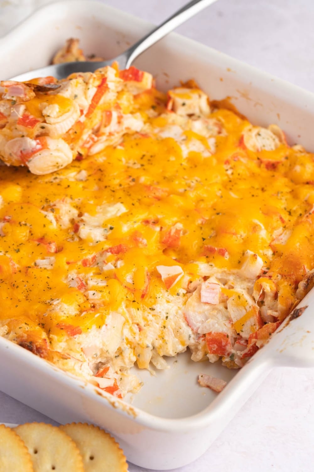 Sweet and Salty Crab Casserole with Cheese on a White Baking Dish