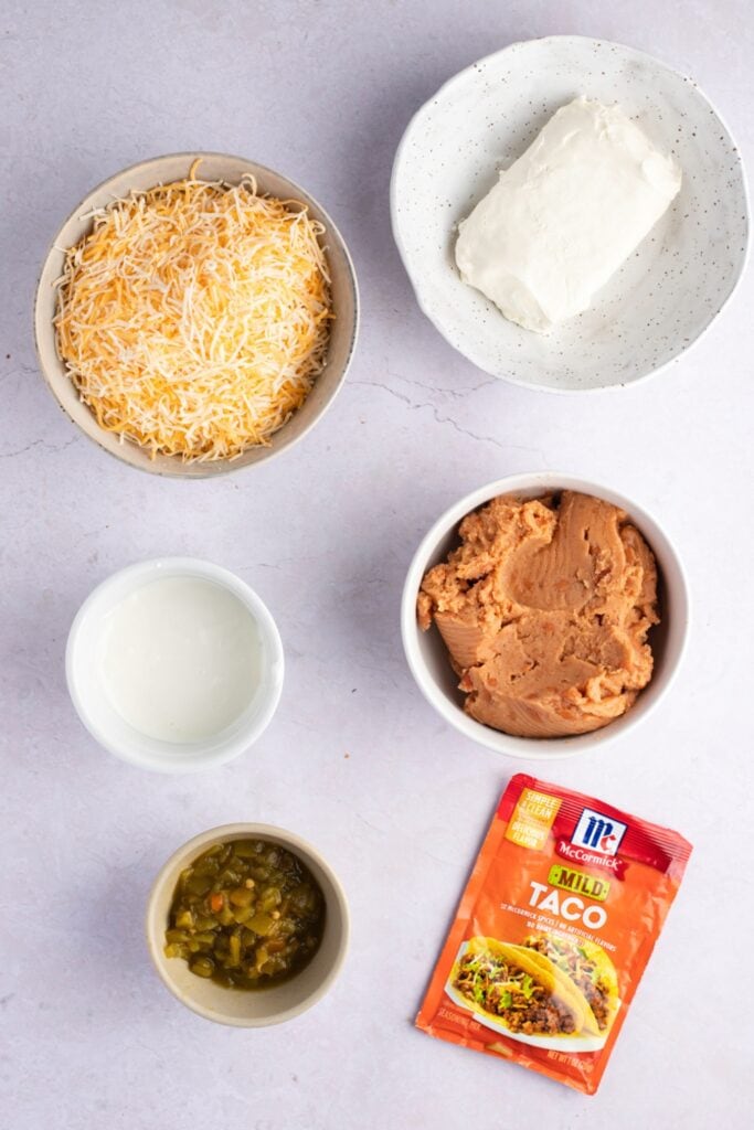 Texas Trash Dip Ingredients - Cream Cheese, Sour Cream, Refried Beans and Green Chiles