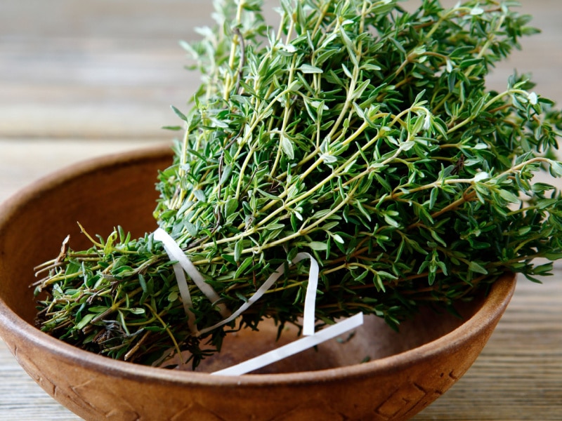 Fresh Thyme on a Wooden Bowl