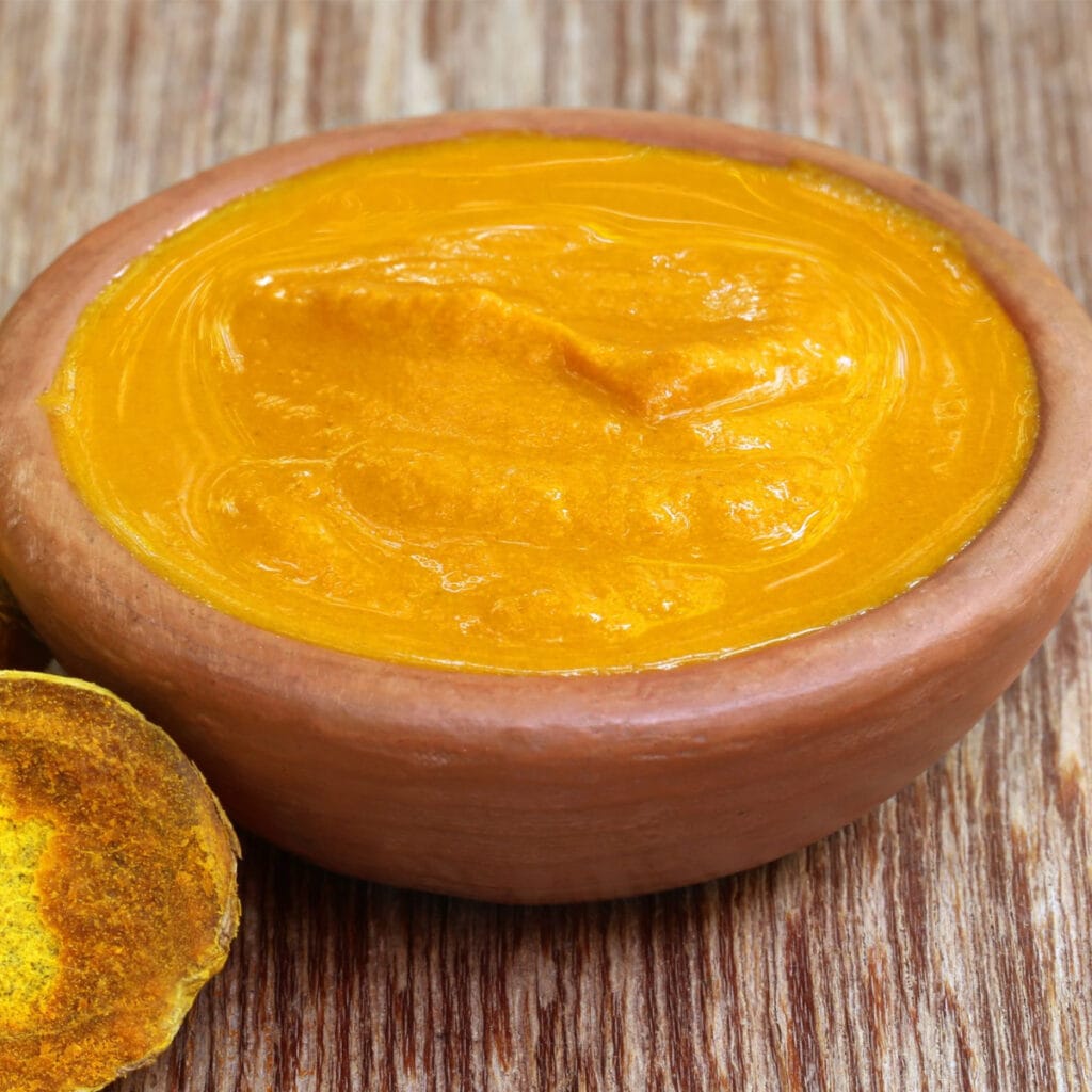 Turmeric Paste in a Clay Bowl