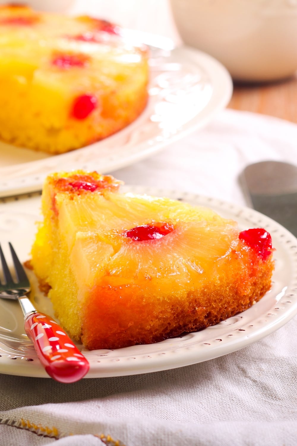 A Slice of Pineapple Upside Down Cake with Cherries