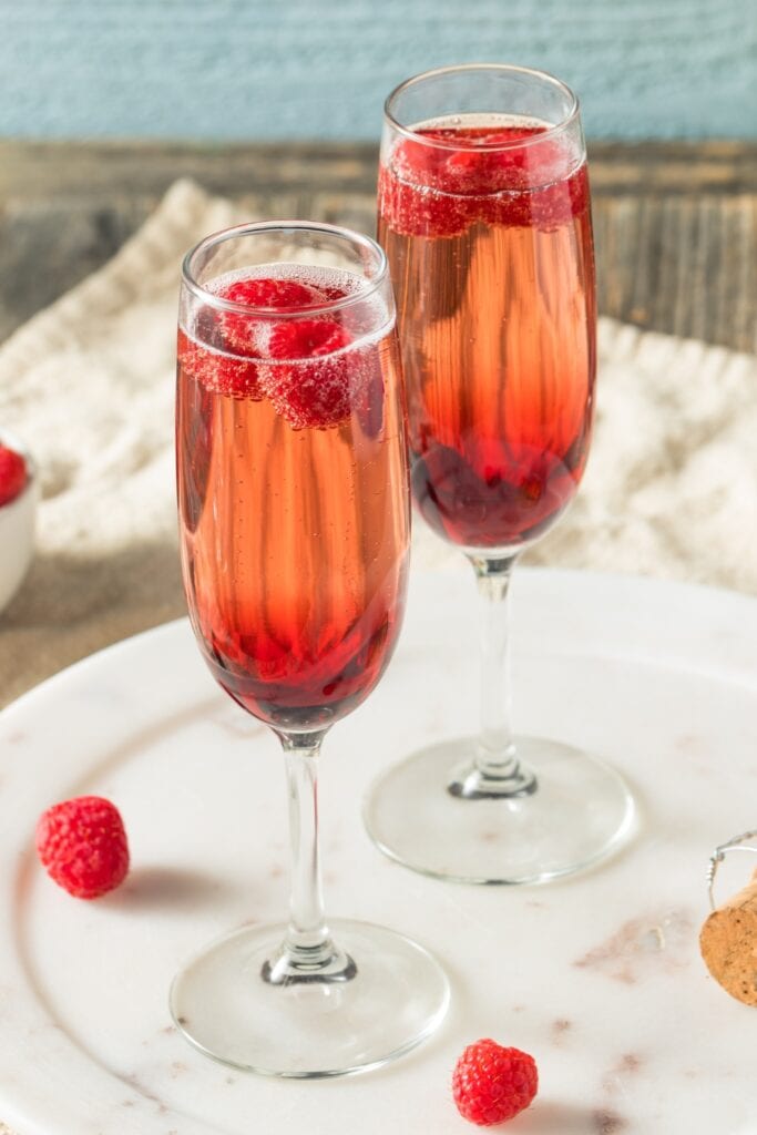 Alcoholic Kirk Royale with Champagne and Raspberries