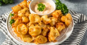 Appetizing Cheese curds with Herbs and Dipping Sauce