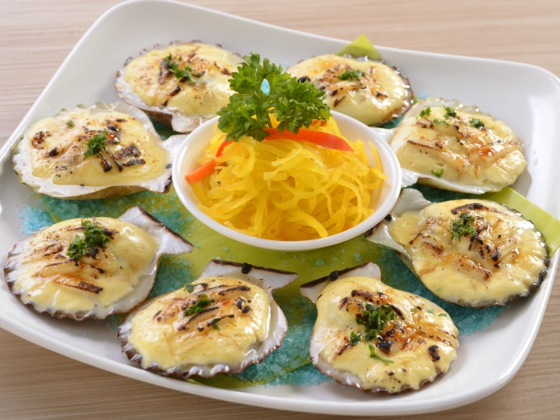 Eight Pieces of Baked Scallops on a Square Plate