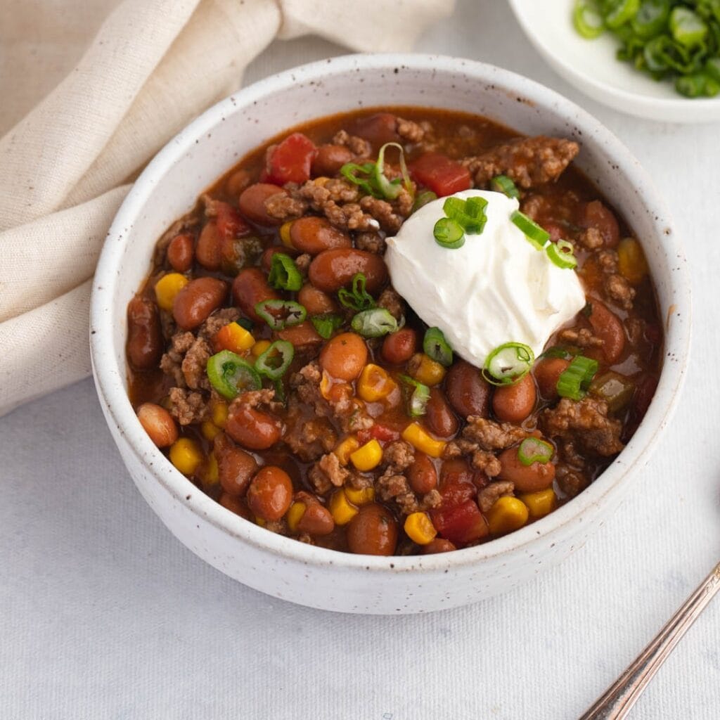 Bowl of Warm Taco Soup with Ground Beef, Beans and Corn