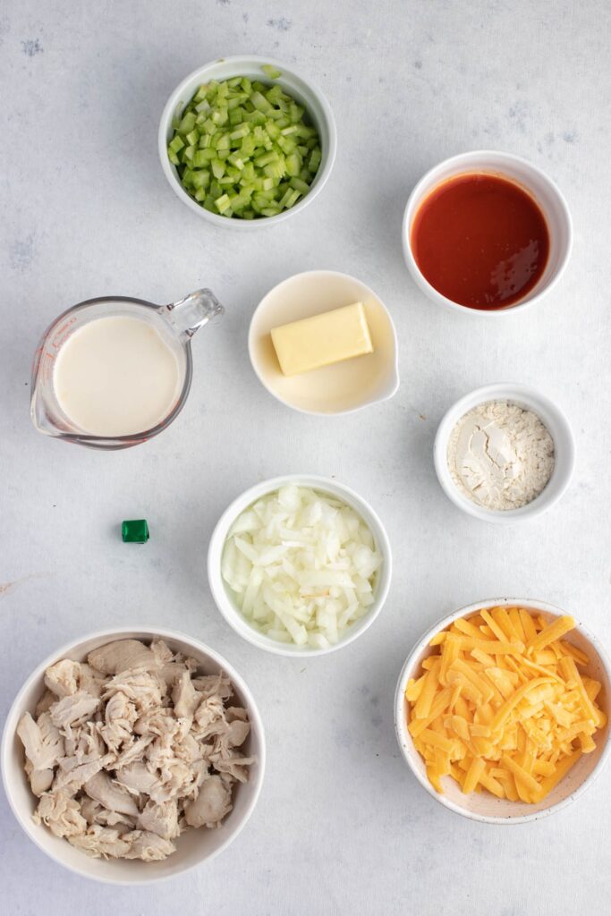 Buffalo Chicken Soup Ingredients - Butter, Vegetables, Flour, Half-and-Half and Water, Cubed Chicken, Buffalo Wing Sauce, Cheddar Cheese, Chicken Bouillon, Salt and Pepper
