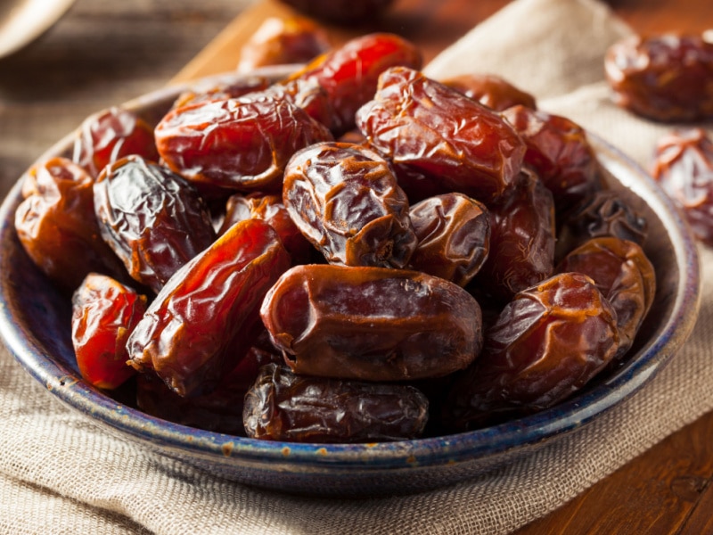 Bunch of Ripe Dates in a Saucer