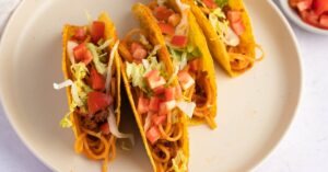 Delicious Homemade Spaghetti Tacos with Vegetables and Onions