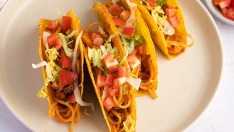 Delicious Homemade Spaghetti Tacos with Vegetables and Onions