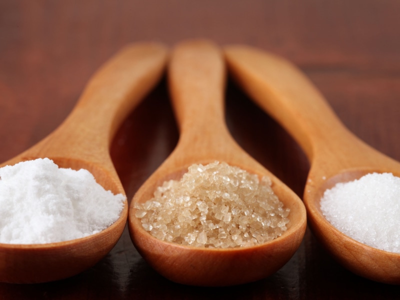 Different Types of Sugar on a Wooden Spoon