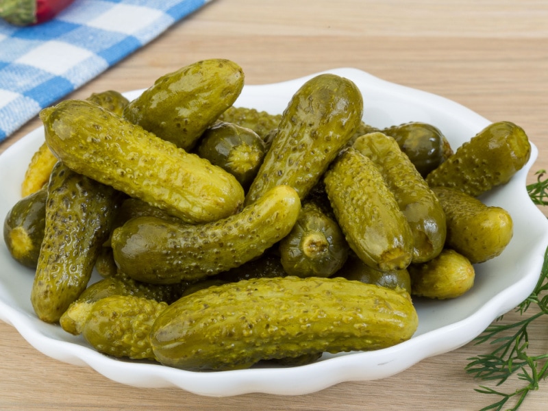 Dill Pickles on a Ceramic Plate