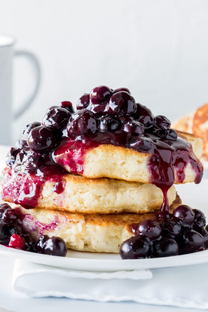 Fluffy Stack of Pancakes with Blueberry Sauce