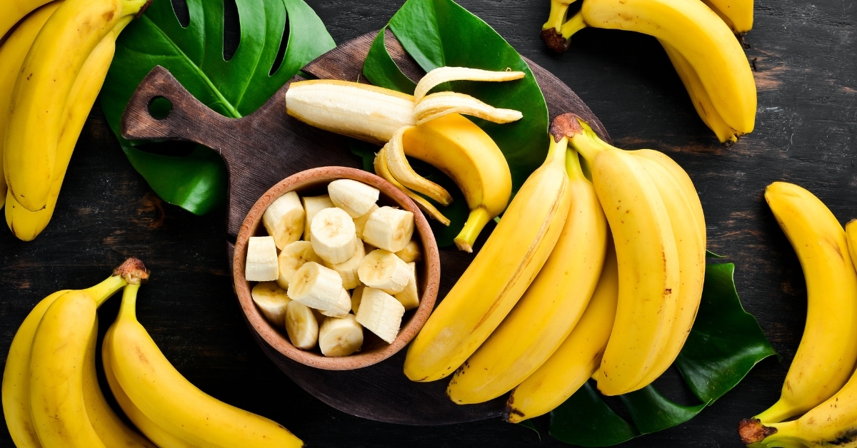 Fresh Organic Yellow Bananas in Wooden Background