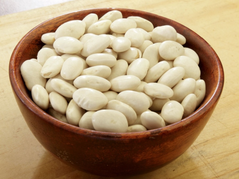 Raw Great Northern Beans in a Wooden Bowl