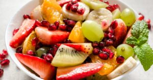 Healthy Fruit Salad with Kiwi, Strawberries, Pomegranate and Grapes