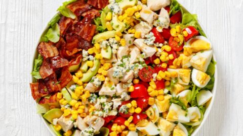 Healthy Salad with Chopped Romaine Lettuce, Bacon, Tomato, Chicken Breast, Avocado and Egg