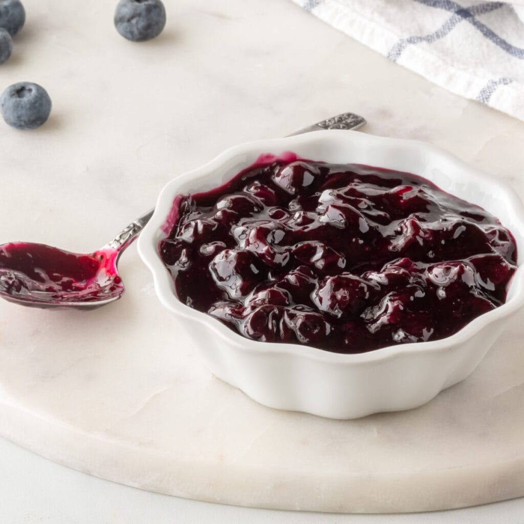 Blueberry Sauce in a Small White Dish