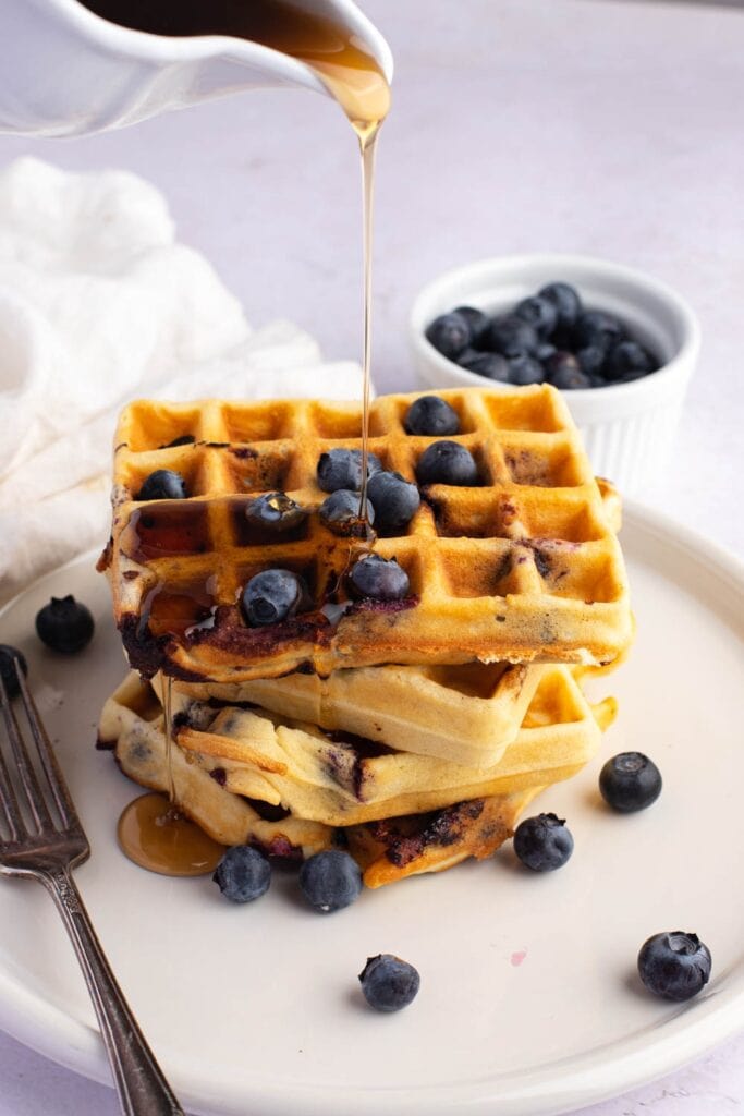 Homemade Blueberry Waffles Poured with Honey