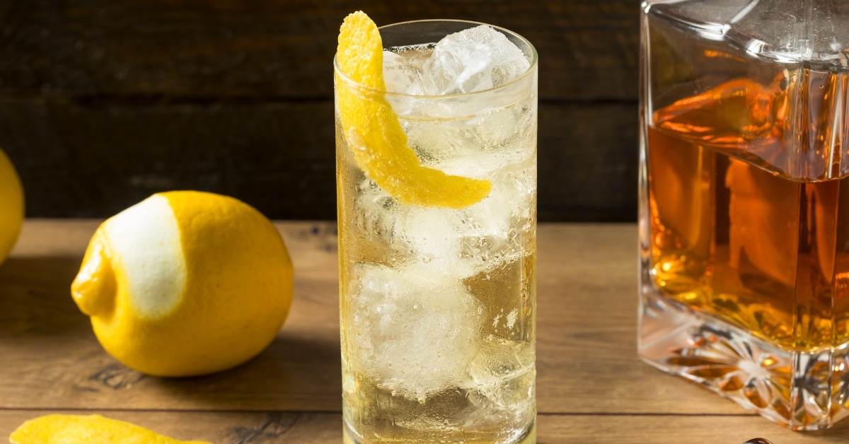 Homemade Boozy Whiskey and Soda Highball Cocktail with Lemon