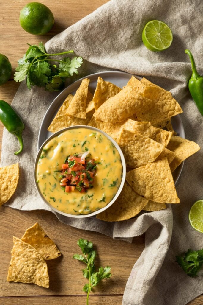 Homemade Cheesy Queso Dip with Tomatoes and Chips